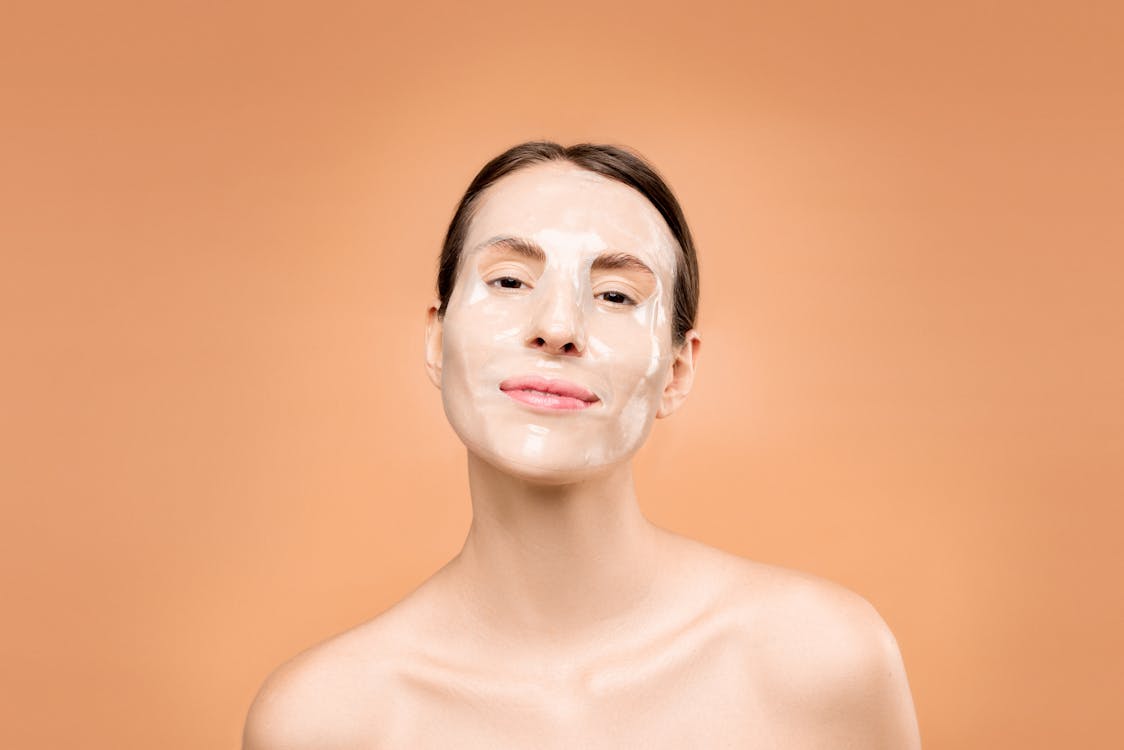 Woman with glowing skin after red light therapy anti-aging facial